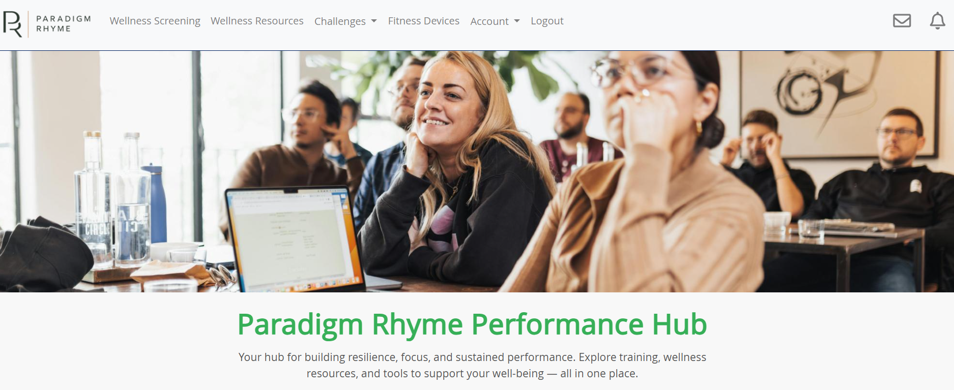 Person using the Paradigm Rhyme Platform app on a laptop during a quiet moment at work