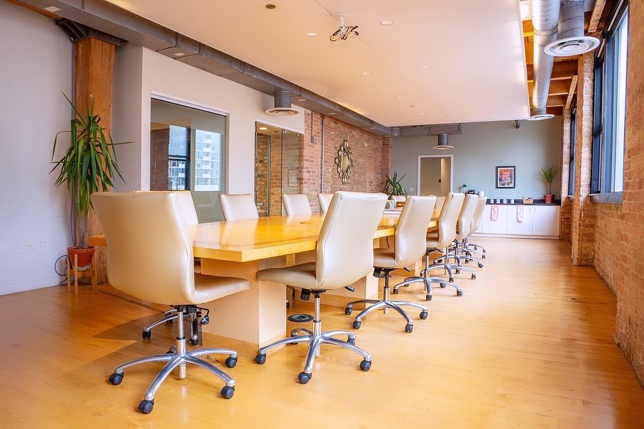 Loft-style conference room with exposed brick, available as a Paradigm Rhyme venue
