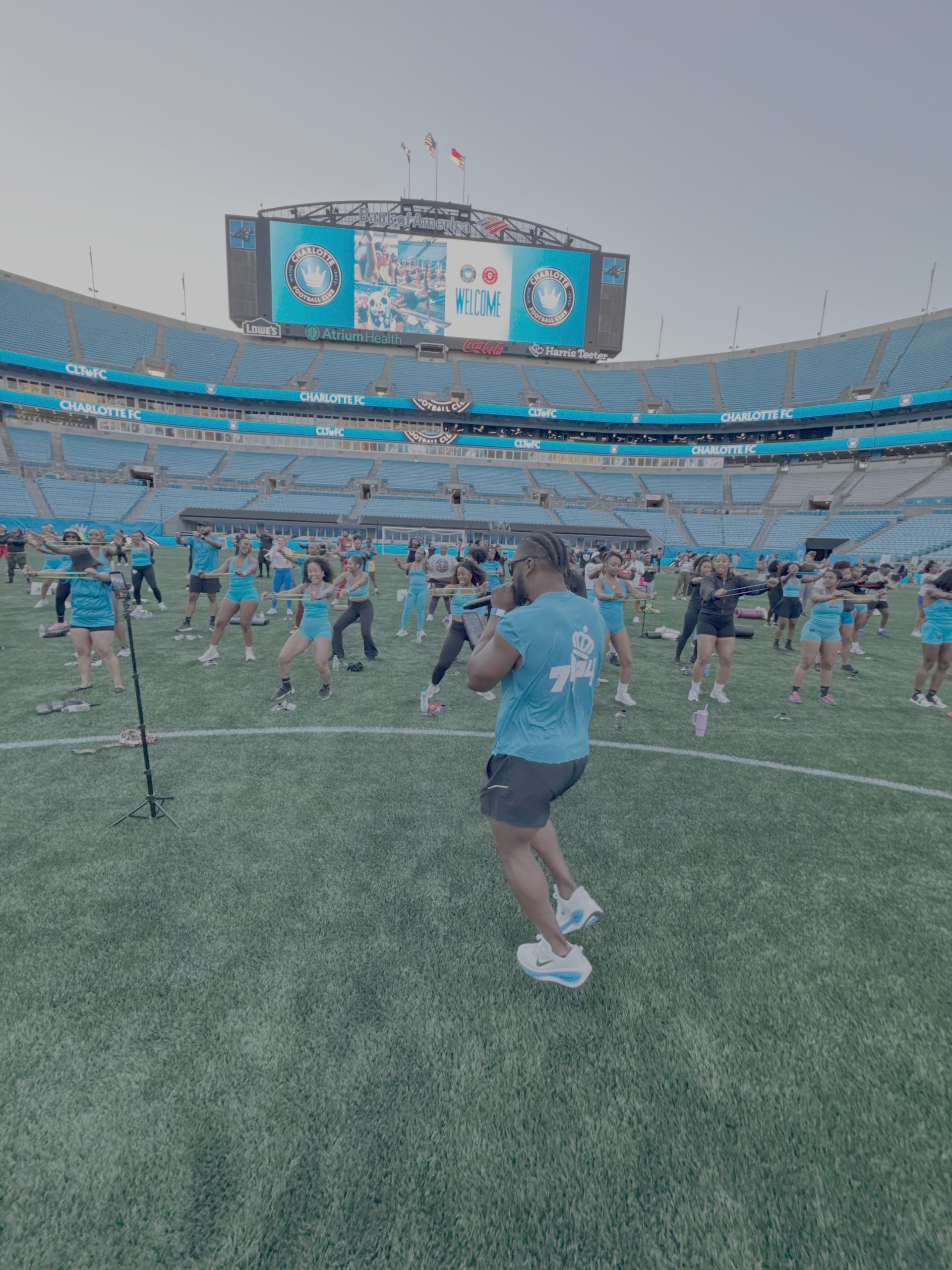 Large-scale Paradigm Rhyme fitness activation on the field at Bank of America Stadium
